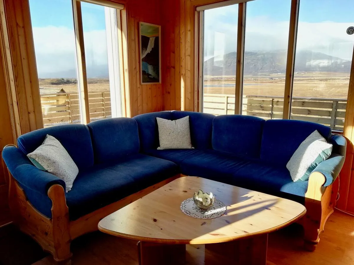 Cosy living room seating inside the Little Blue House Iceland